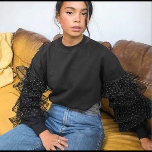 Sweater with organza frills in black